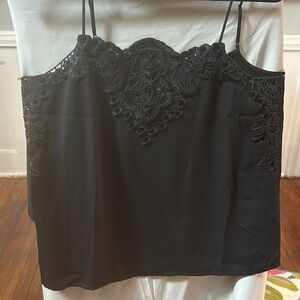 cabi Spring 2024 Baroque Cami. This is a black poly crepe, easy fit cami.